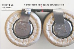 Single small cylindrical cell board on 2 cells